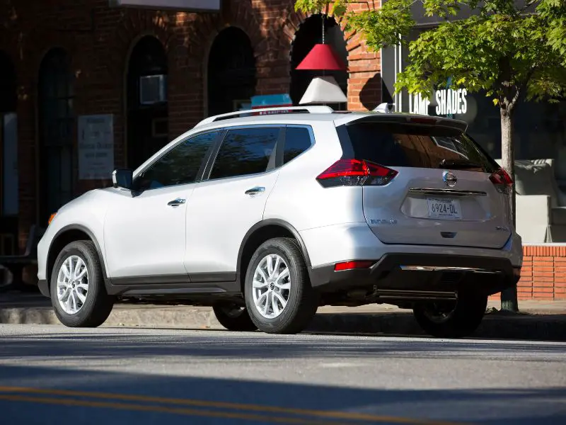 20218 nissan rogue driving on a city street