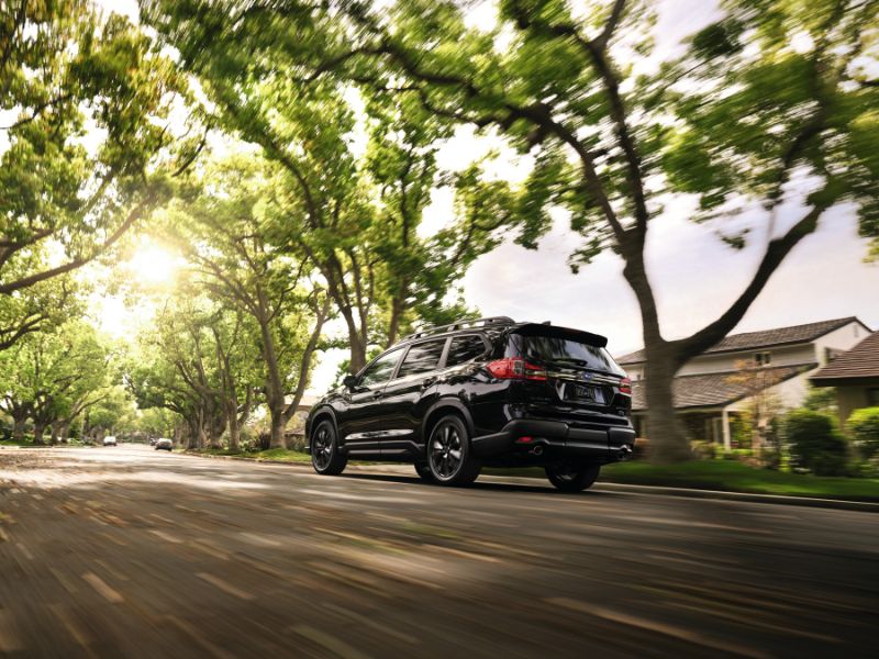 2022 black subaru ascent driving through a suburb