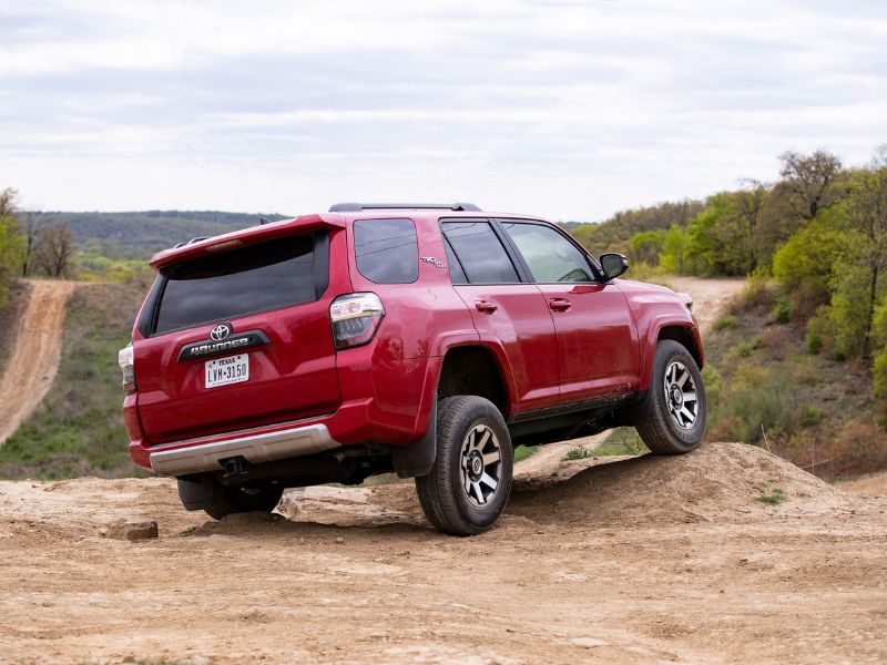 2019 red toyota 4runner trd off-road package doing a axle twister on an off-road course